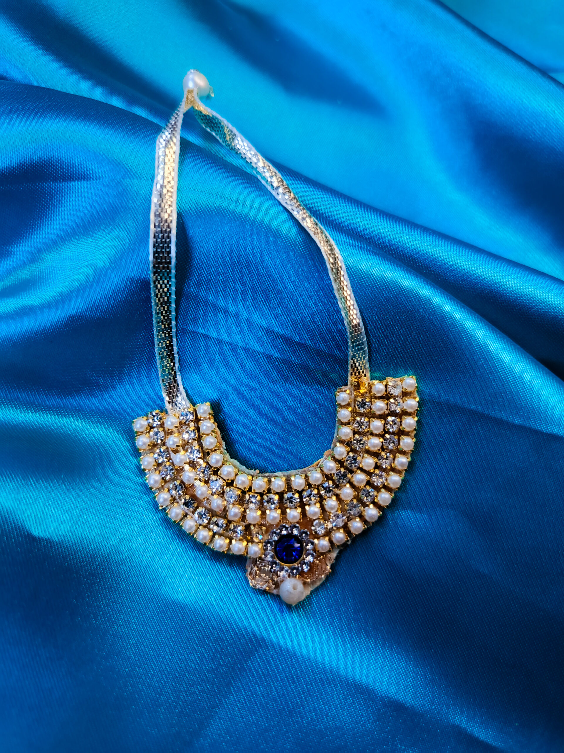 Blue Teardrop Necklace with Golden Accents - Image 2