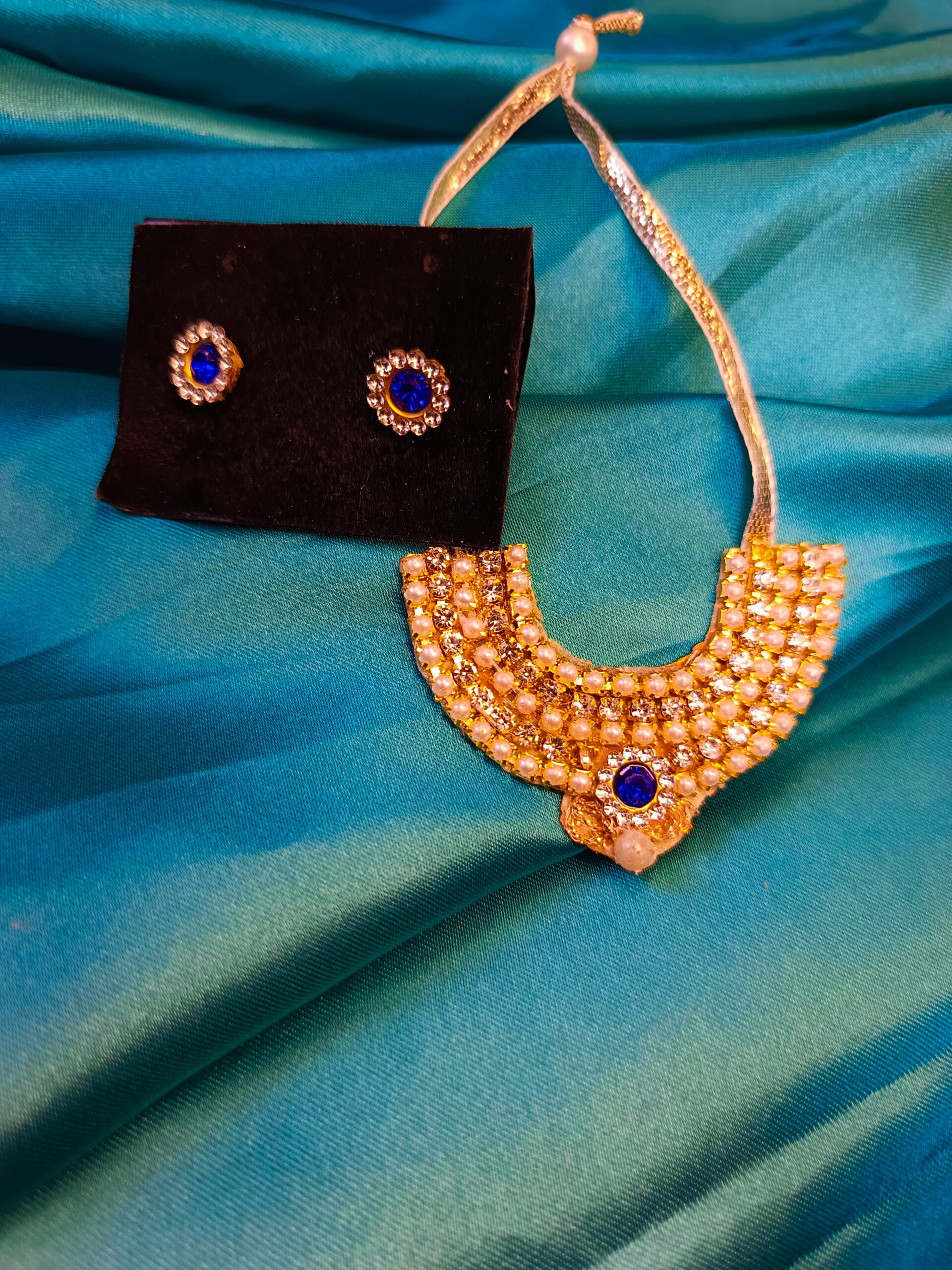 Blue Teardrop Necklace with Golden Accents - Image 3