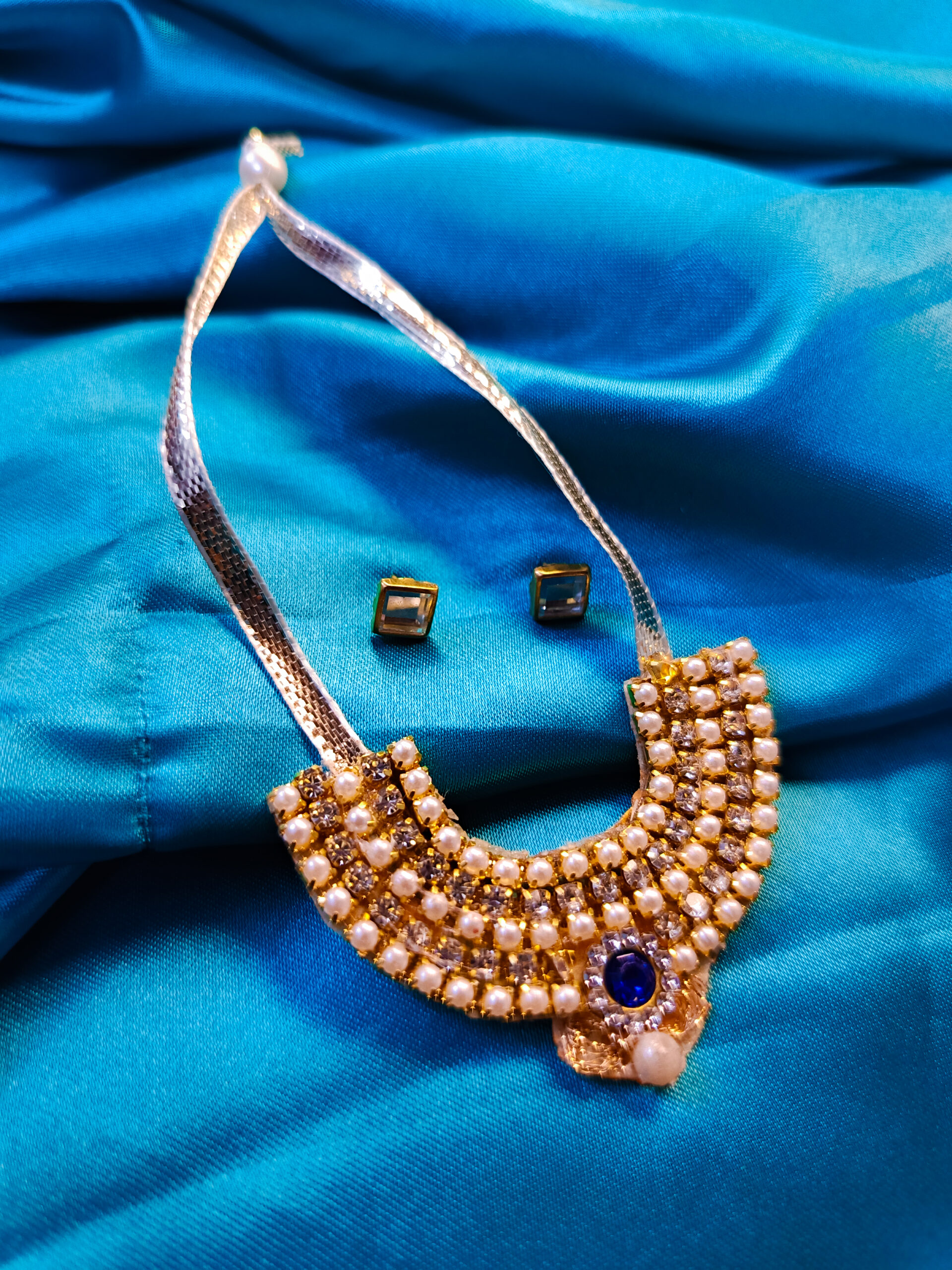 Blue Teardrop Necklace with Golden Accents